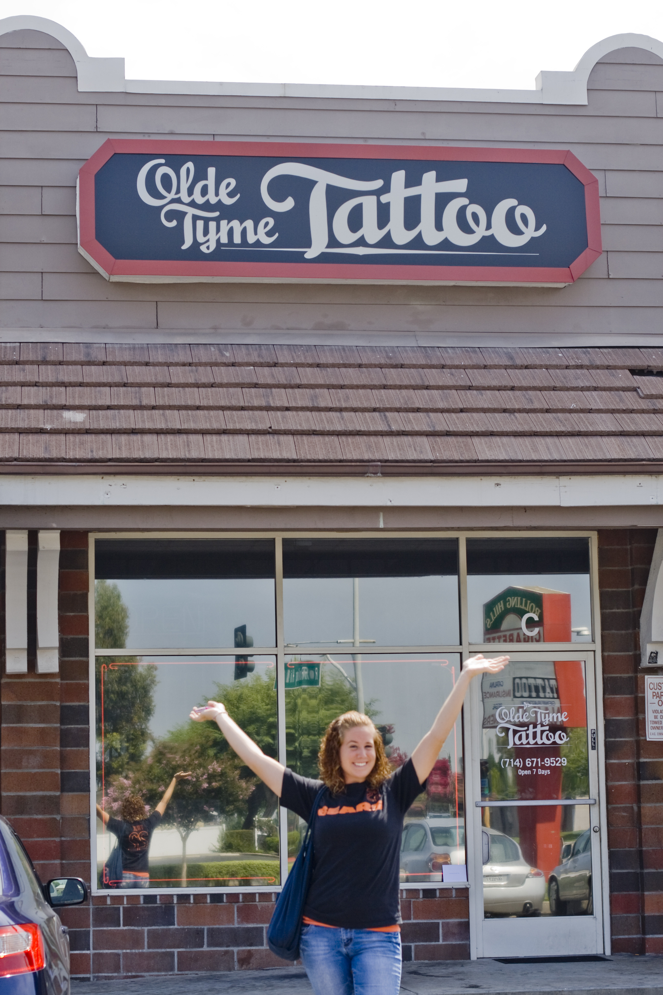 Melissa in front of our tattoo parlor