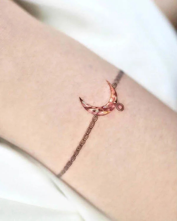 Cute and realistic moon jewelry tattoo for women by @yoda_ink