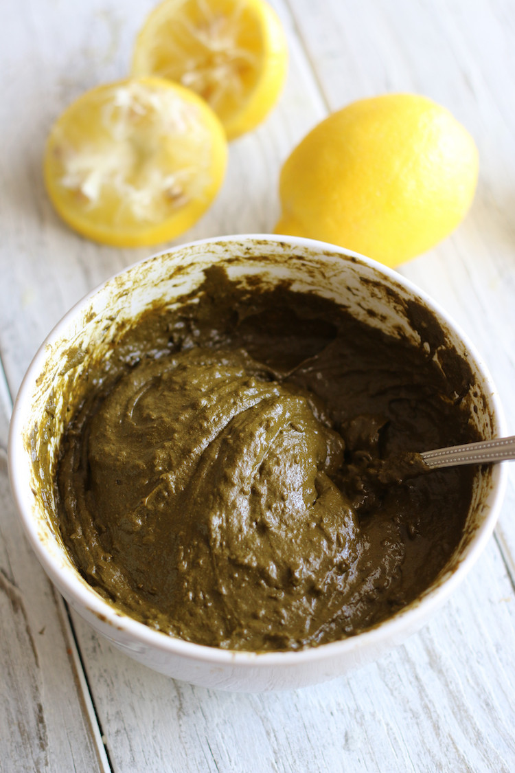 Applying natural henna tattoo paste for temporary skin staining