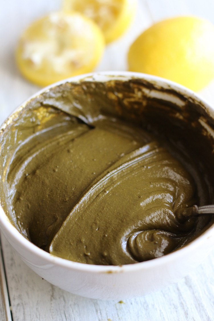 Applying natural henna tattoo paste with essential oil