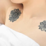 Woman sleeping with tattoos