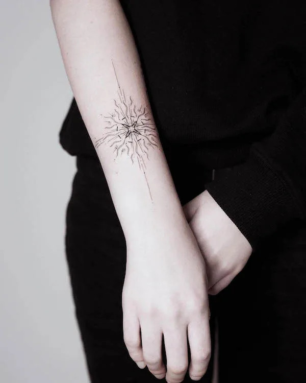 Intricate radiating sunshine bracelet tattoo by @ninapost.ink_