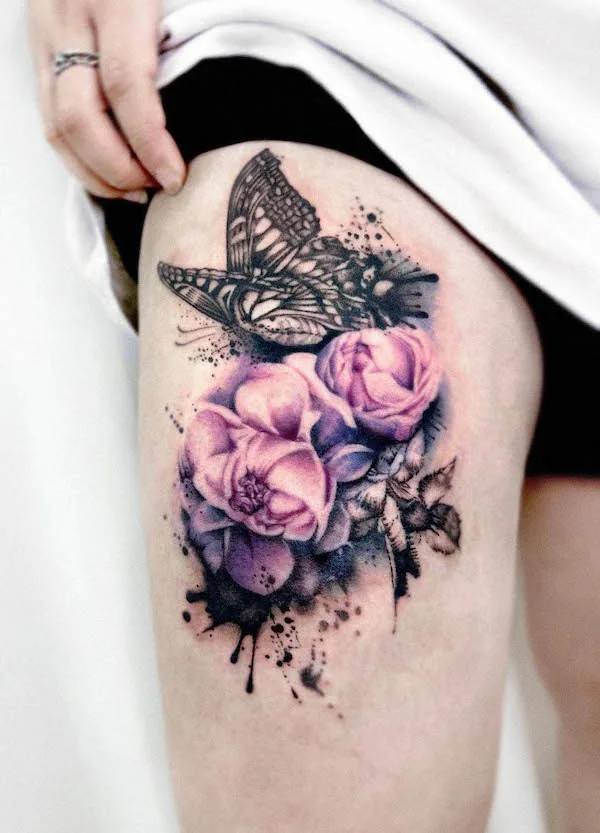 Realistic rose and butterfly tattoo on the thigh, by @gooka.tattoo, blending natural beauty with symbolic transformation
