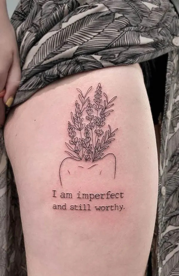 Fine line self-love tattoo on the thigh, by @muchttoomuch, promoting self-acceptance and care