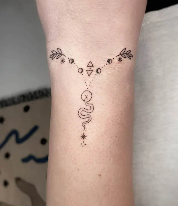 Unique small snake geometric bracelet tattoo by @trikona.tattoos
