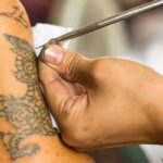 Hand-poked tattoo showcasing a simple design