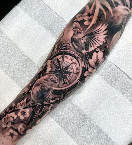 Stunning Sleeve Tattoo with Flowers, Birds and Watch
