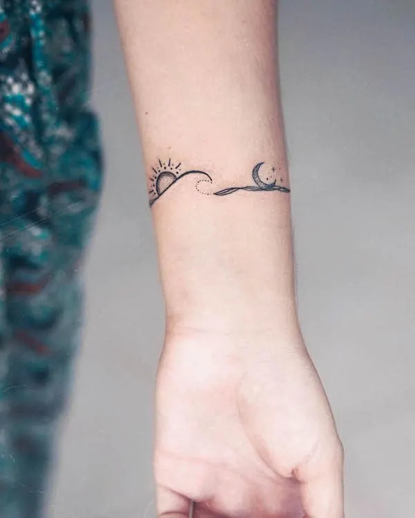 Ocean themed sun, moon and waves wrist tattoo for women by @zmfreespirit