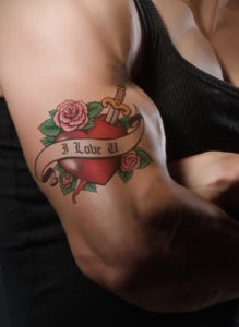Woman's Should With Colorful Tattoo