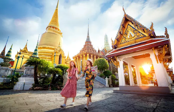 A traveler in Thailand with a covered religious tattoo, respecting local customs and avoiding potential offense.