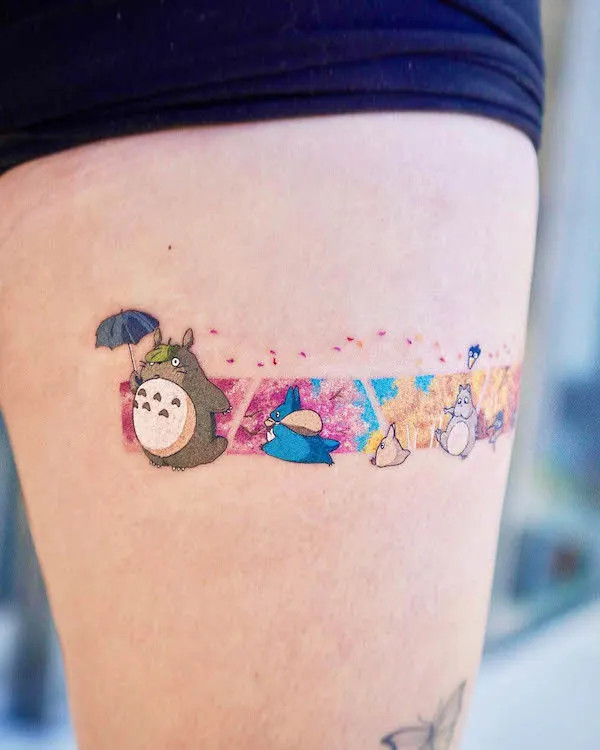 Thigh band tattoo featuring Tororo and friends, by @daldam__, a whimsical and nostalgic design