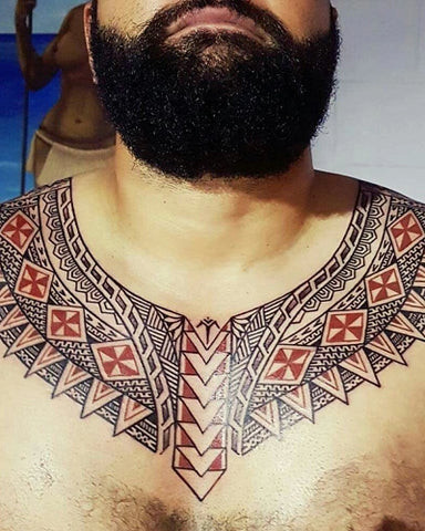 Bold tribal pattern extending across the collarbone