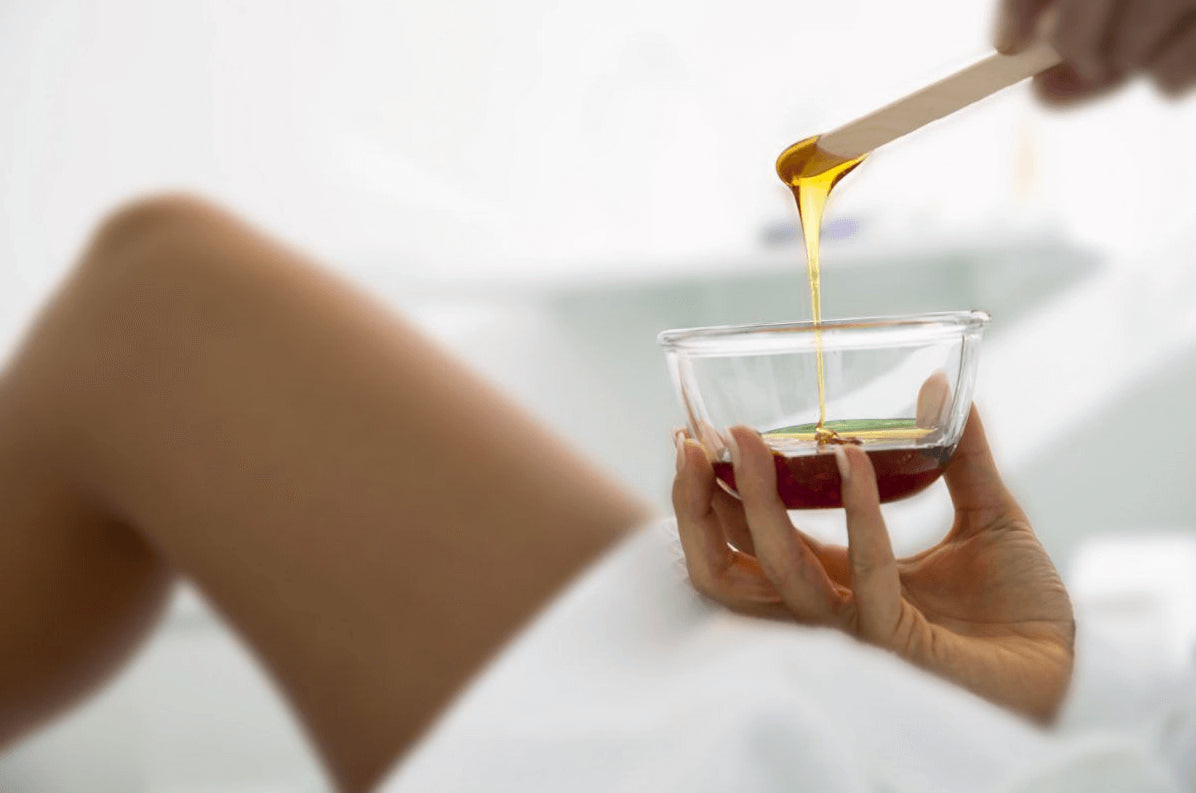 Waxing hair removal for tattooed skin